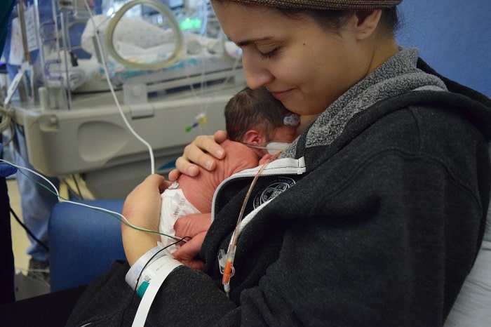 baby Petra is held by her parents after her premature birth 03